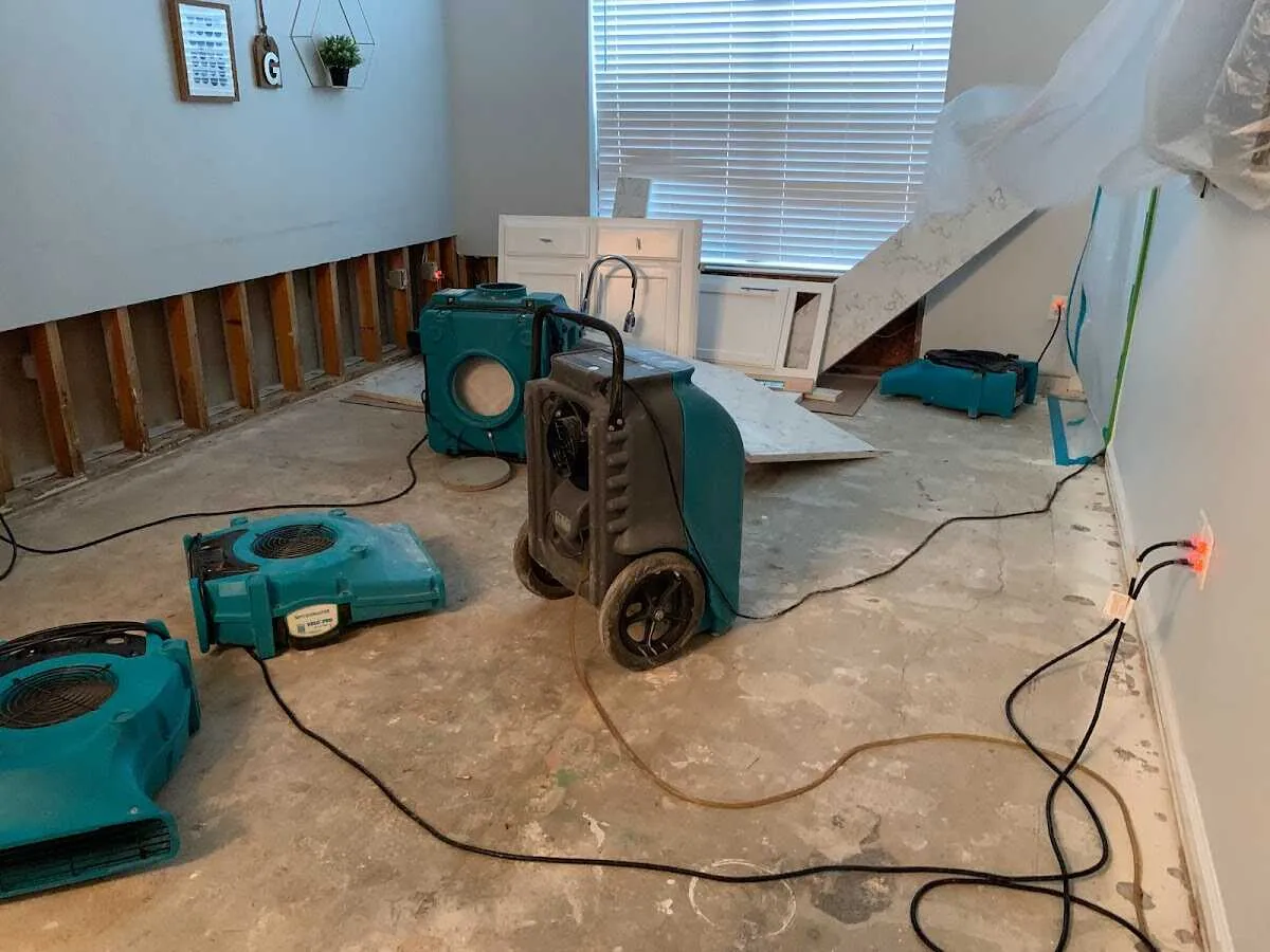 Dehumidifier in flood-cut room for Water Damage Restoration in Wantage